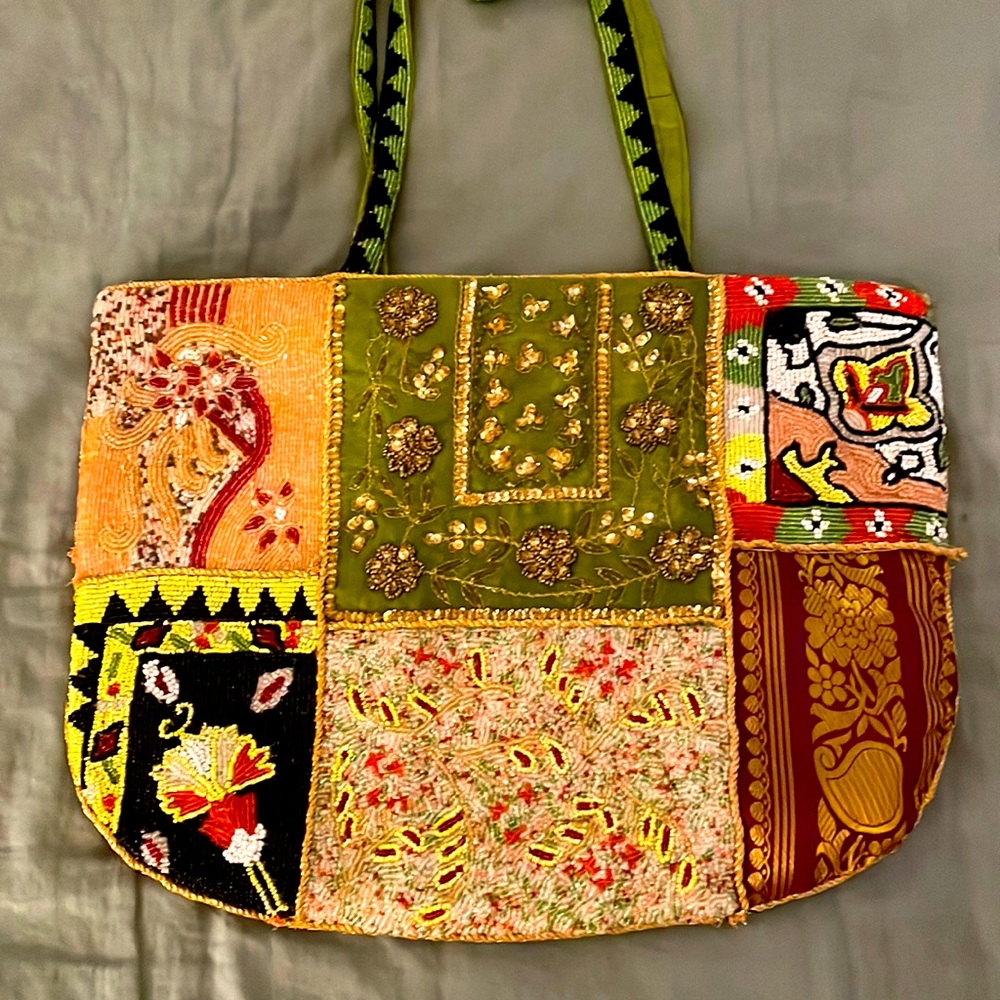 Exquisite bejeweled bag with zipper and satin lining